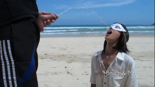 Public piss drinking and cum facial on the beach BruceandMorgan
