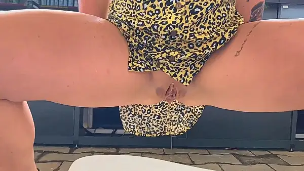 Girl pisses in a litter box in the pet shop