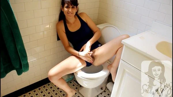 SallySmiles – Peeing in Public Bathroom