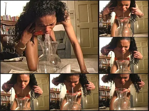 Topless Ebony Girl Pukes in a Flower Vase