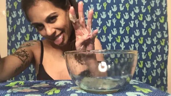 Brunette Girl gagging and vomiting in a bowl
