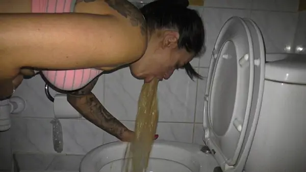 Girl feel very sick and vomiting in the toilet