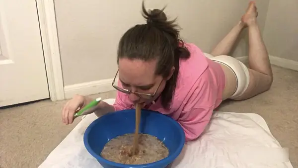 Glasses girl puking in a bowl floor