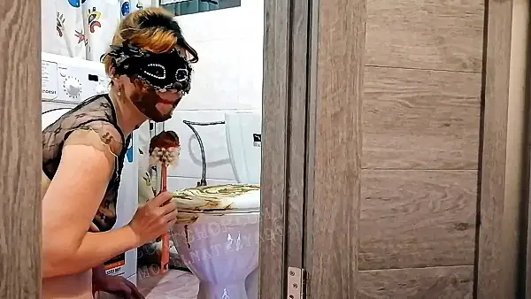 Real slave licks the toilet brush